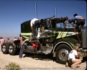 The crew hangs lights on the Big Green Kenworth