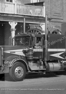Claude Akins climbs out of Kenworth