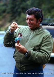 Claude Akins with mirror ornament