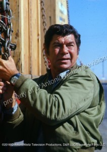Claude Akins checks the load