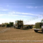 White Star, GMC, and Kenworth tractors lined up to race in Movin' On