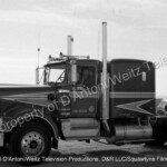 Claude Akins behind the wheel of Sonny Pruitt's Kenworth