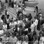 Claude Akins signs autographs for a crowd of fans