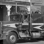 Claude Akins climbs out of Kenworth